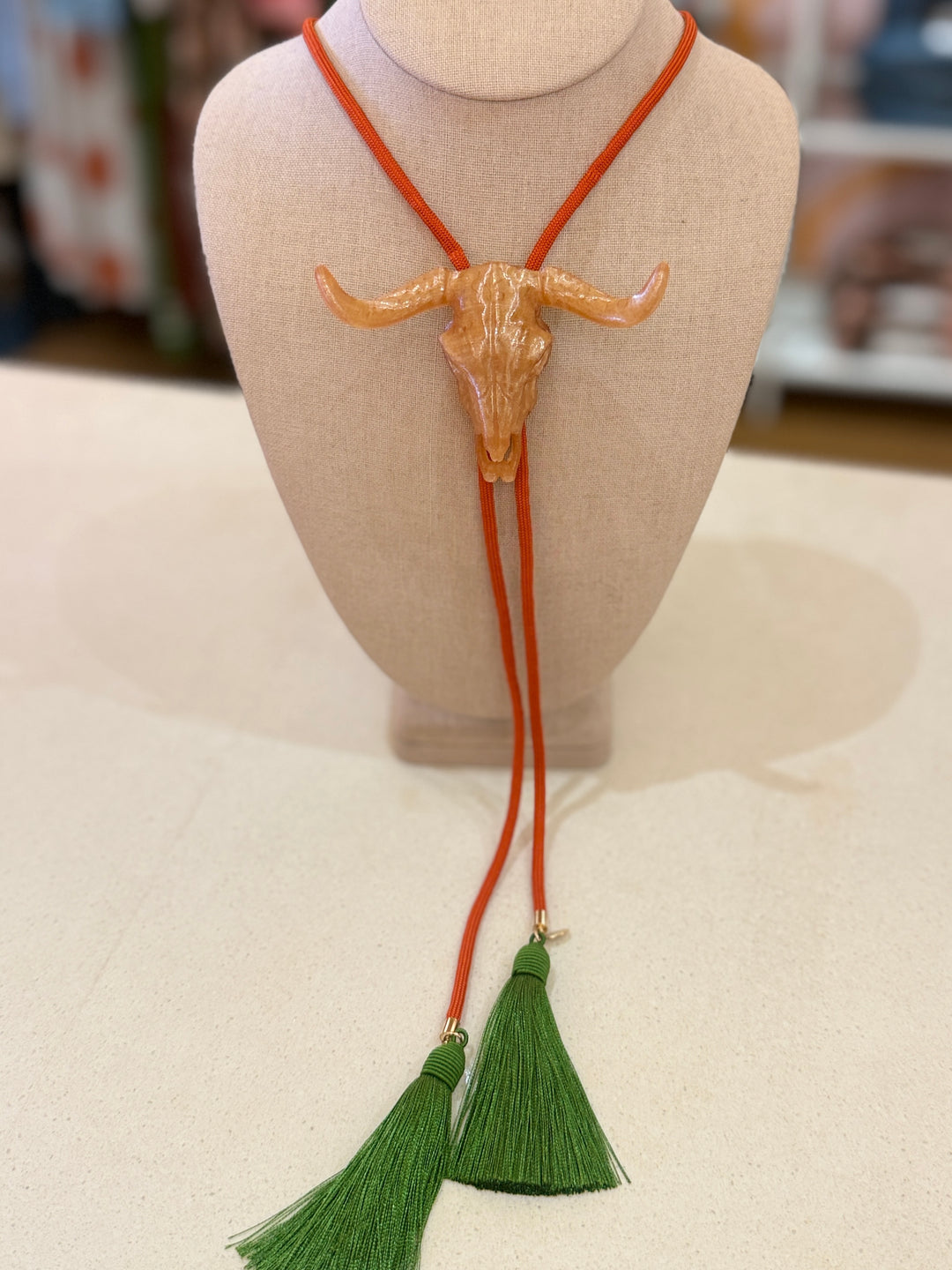 LONGHORN GOLD BOLO W/ORANGE CORD