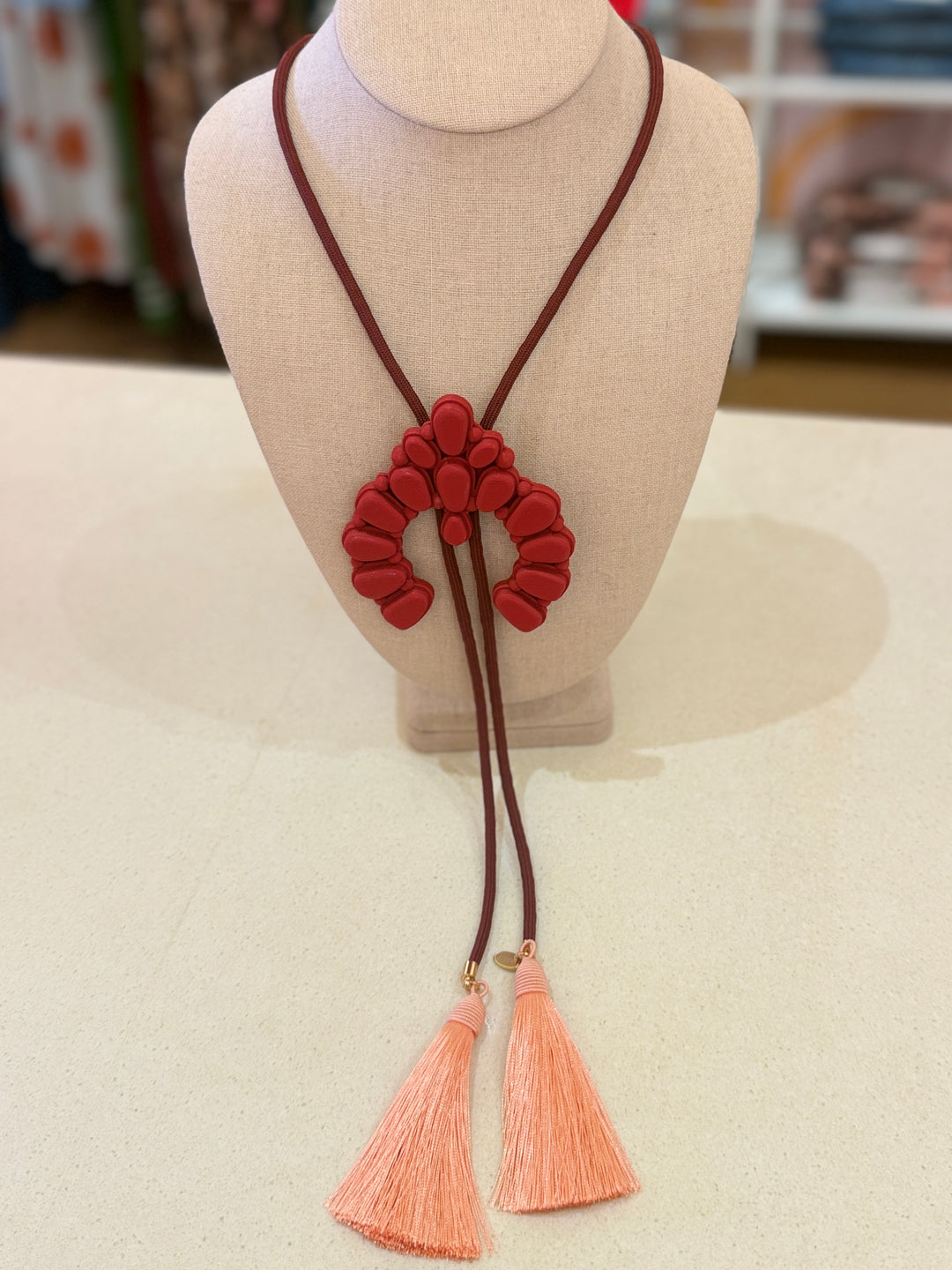 SQUASH BLOSSOM RED BOLO W/WINE CORD