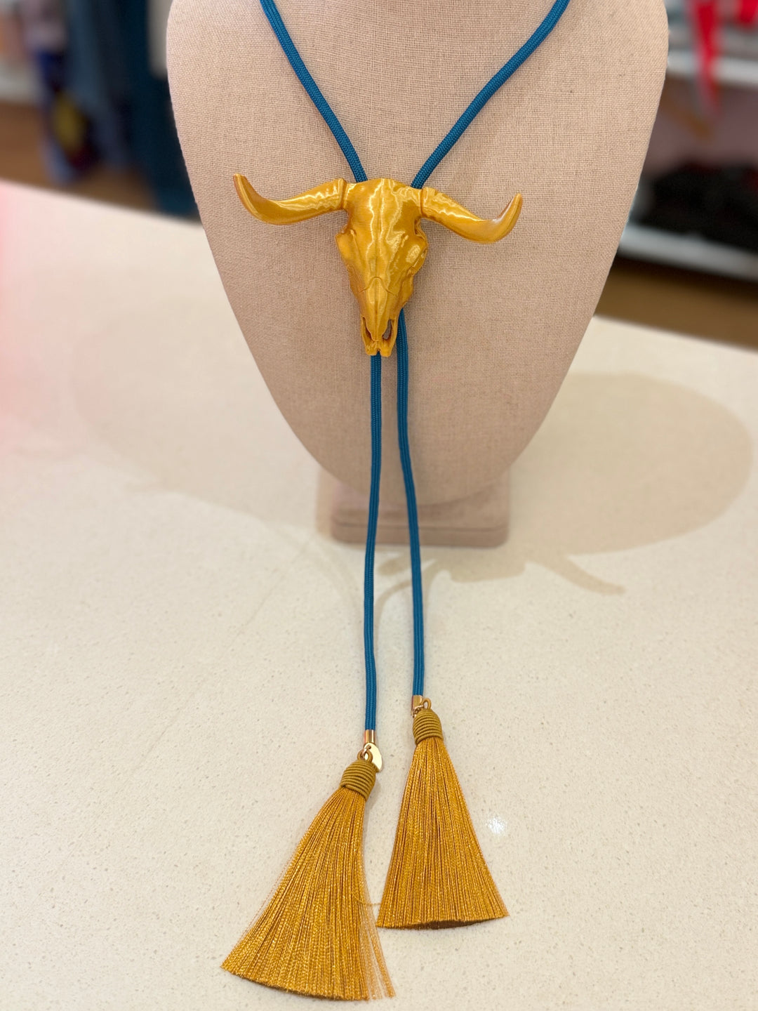 LONGHORN GOLD BOLO W/BLUE CORD