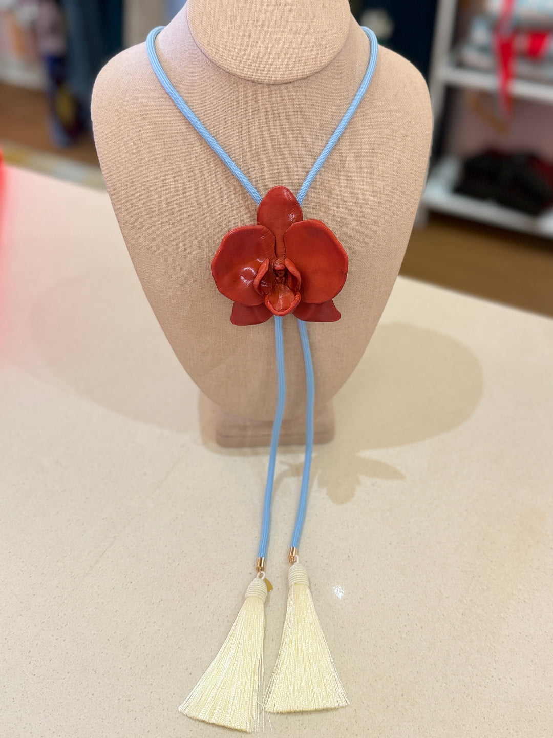 ORCHID RED BOLO W/LT BLUE CORD